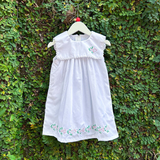 white sleeveless baby dress