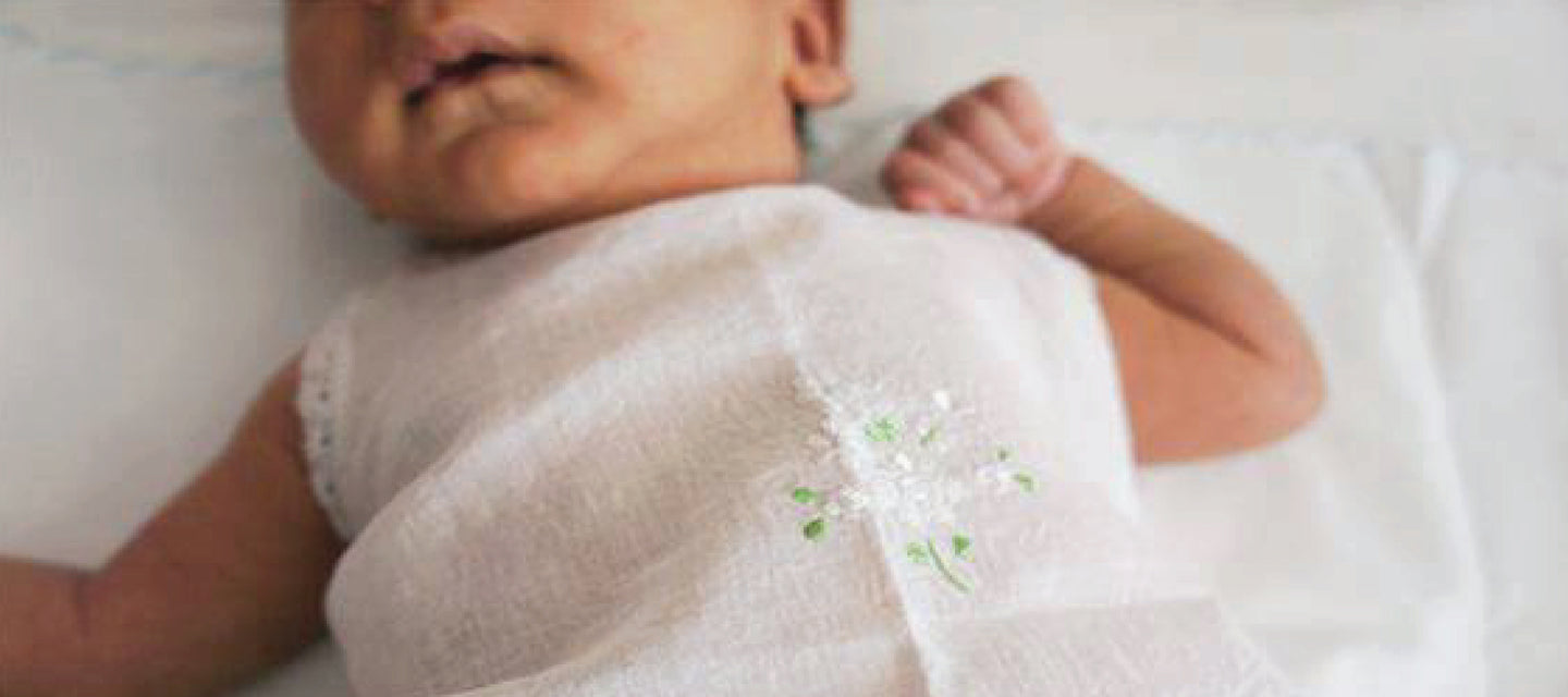 Newborn baby wearing cotton top kettuduppu from Tara Cochin