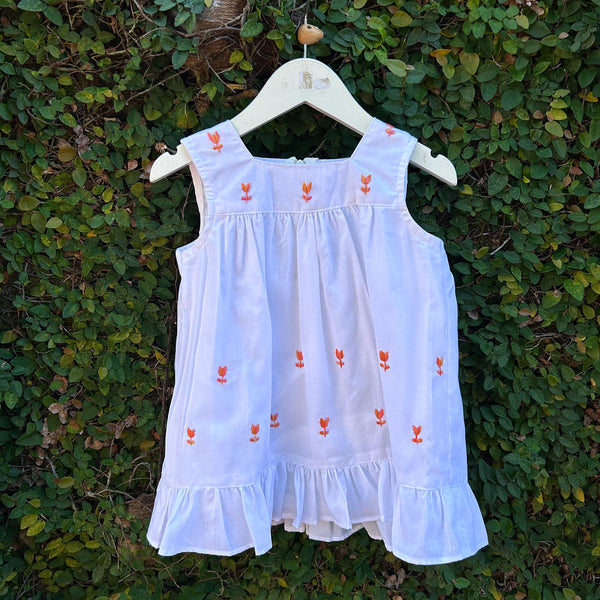 sleeveless white baby dress