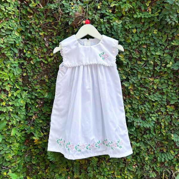 white sleeveless baby dress 