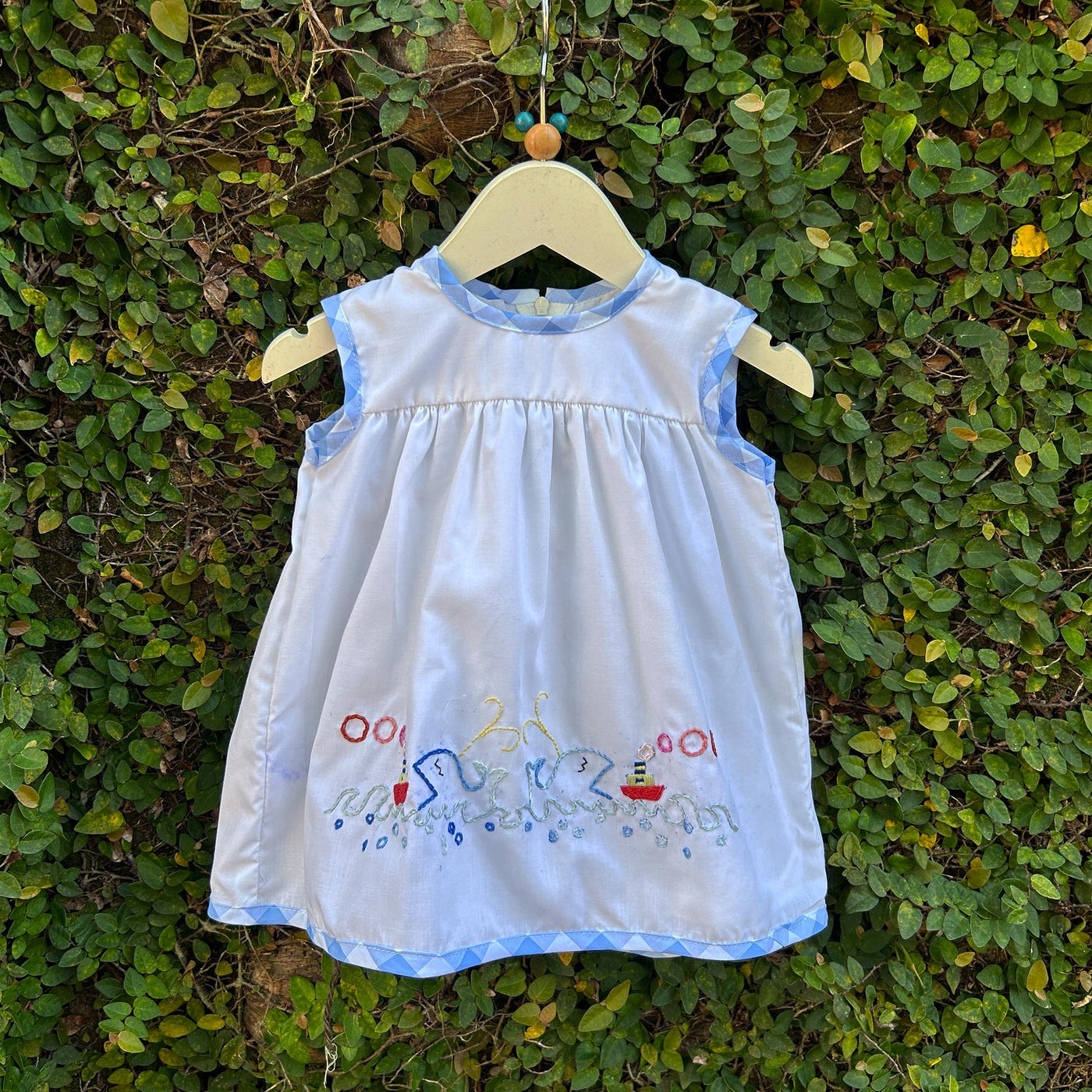 white embroidered baby frock