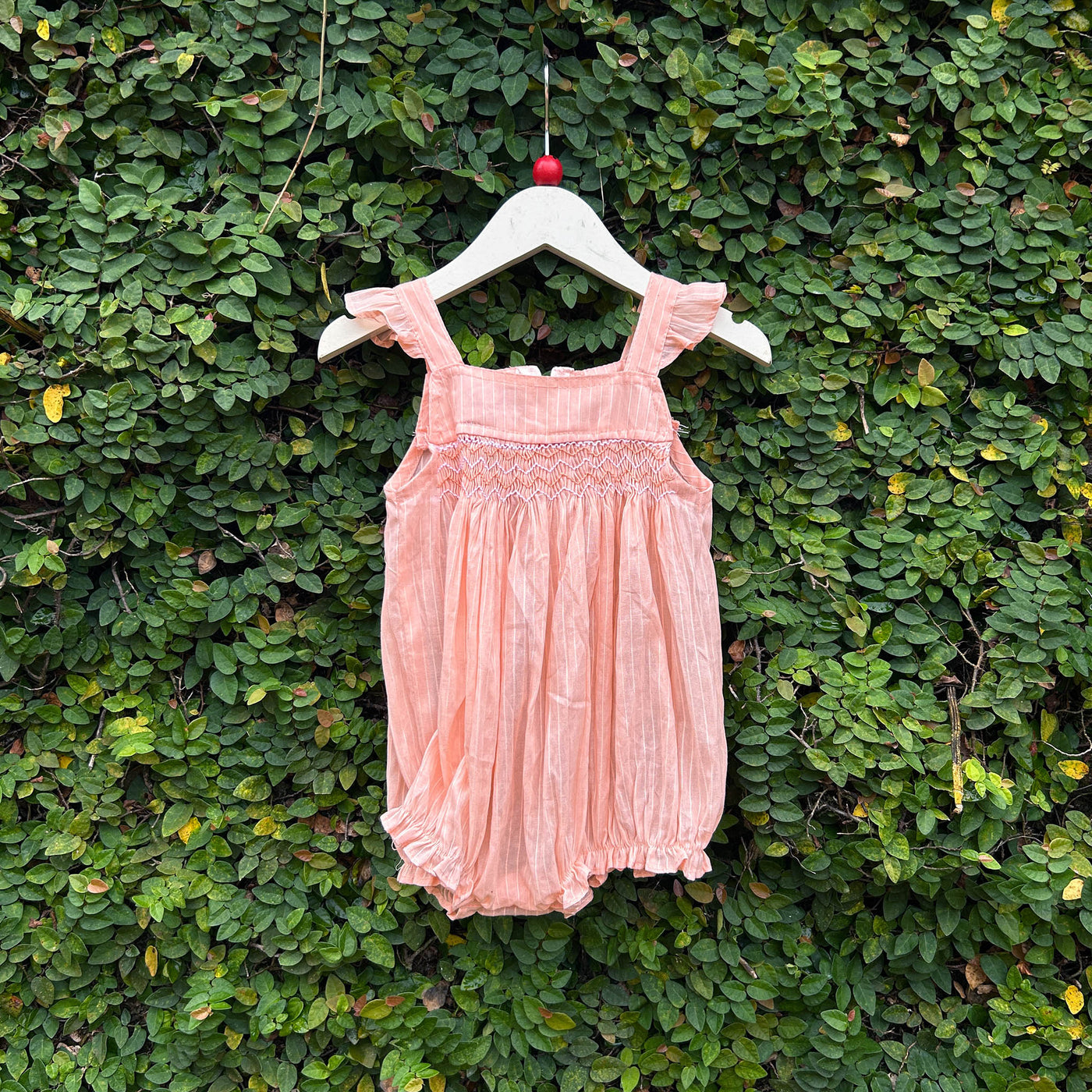 peach smocked baby romper