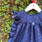 Whimsical Eyelet Apron Baby Dress