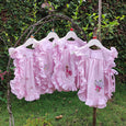 pink apron style baby dress
