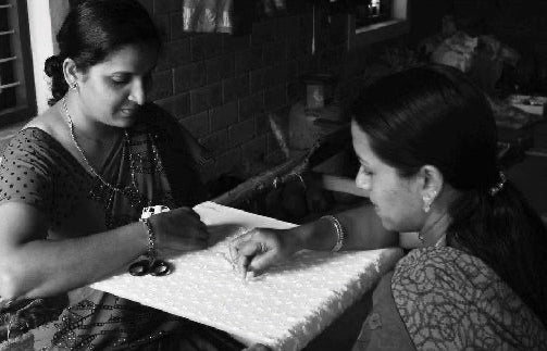 Women work on embroidery fabric - Tara Baby Dress