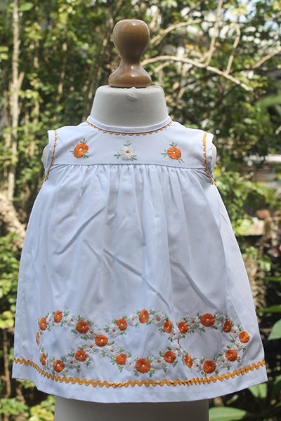 orange and whilte embroidered flowers dress